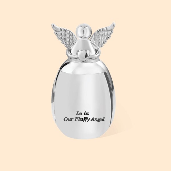 Personalizzazione di un'urna per ceneri a forma di cuore d'angelo incisa con messaggio Regalo in memoria