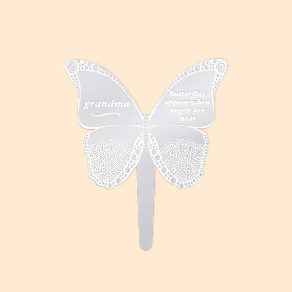 Personifierad minnesmärke fjäril markpinne grav kyrkogård utomhus trädgårdsdekoration sympati gåva eller familj vän