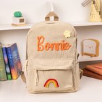 Zainetto personalizzato in velluto a coste con fiore intrecciato arcobaleno e nome ideale per asilo o scuola materna regalo per bambini