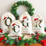 Sacco di Babbo Natale in tela personalizzato con iniziale e nome perfetto come regalo di Natale per famiglia e bambini