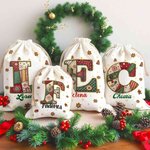 Sacco di tela personalizzato con iniziale e nome design natalizio fiocco di neve bomboniere per vigilia di Natale regalo per bambini