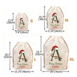 Personalised Bell Holly Santa Hat Initial Drawstring Canvas Gift Bag with Name and Text Christmas Party Gift for Family Kids