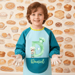 Personliggjør kokkehatt Cartoon Character vanntett langermet forkle med initialnavn og lomme Maleri Baking Essential Bursdagsgave til barn