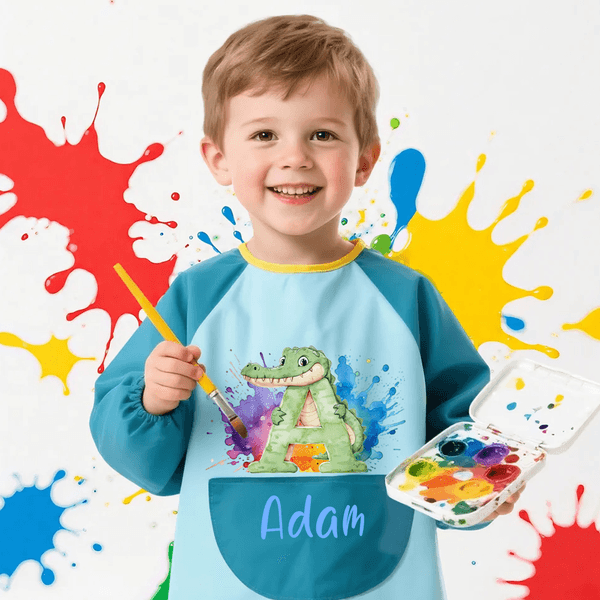 Personalizza il grembiule impermeabile a manica lunga con nome e tasca per il compleanno di un bambino.