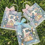 Bolsa transparente personalizada con nombre e inicial diseño de pascua con lazo rosa conejo y pollitos regalo de fiesta para niños
