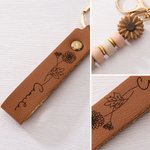 Personalized Birth Flower PU Leather Keychain with Engraved Name and Daisy Bead Pendant Wedding Party Birthday Gift for Bridesmaids Friends